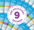 Dermal Therapy lip balm tubes arranged in a pattern with a large circular graphic showing the number nine in the centre with text "one sold every 9 seconds"