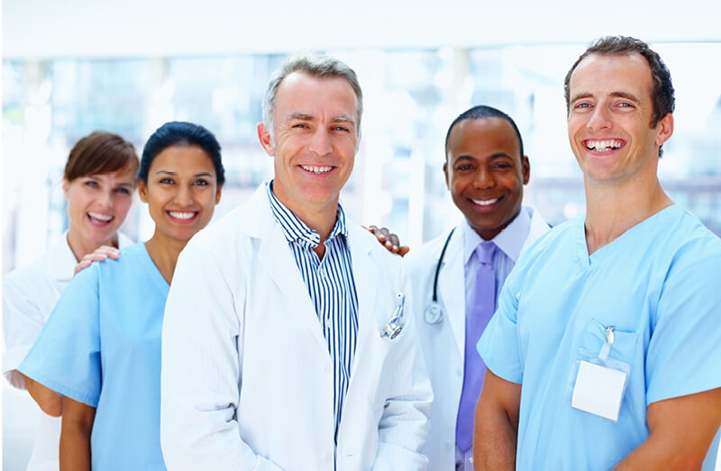 A group of smiling healthcare professionals, accompanied by text encouraging users to read testimonials from doctors, nurses, pharmacists & podiatrists who use and recommend Dermal Therapy products.