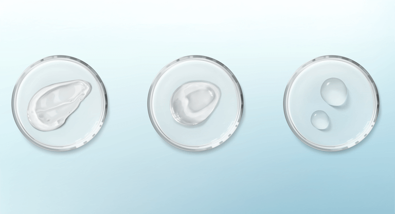 Three samples to represent urea in skincare on petri dishes with a blue background