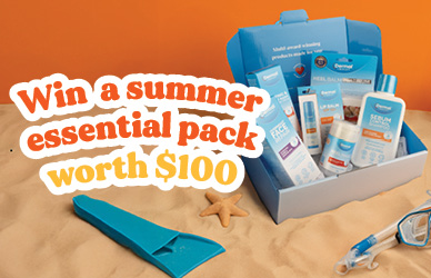 A blue gift box filled with Dermal Therapy skincare products displayed on sand with summer accessories like snorkel gear and starfish. Text overlay reads: “Win a summer essential pack worth 0.”