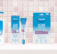 Dermal Therapy Acne Control skincare products including wash, spot cream, clear patch, and lotion displayed against a tiled background.